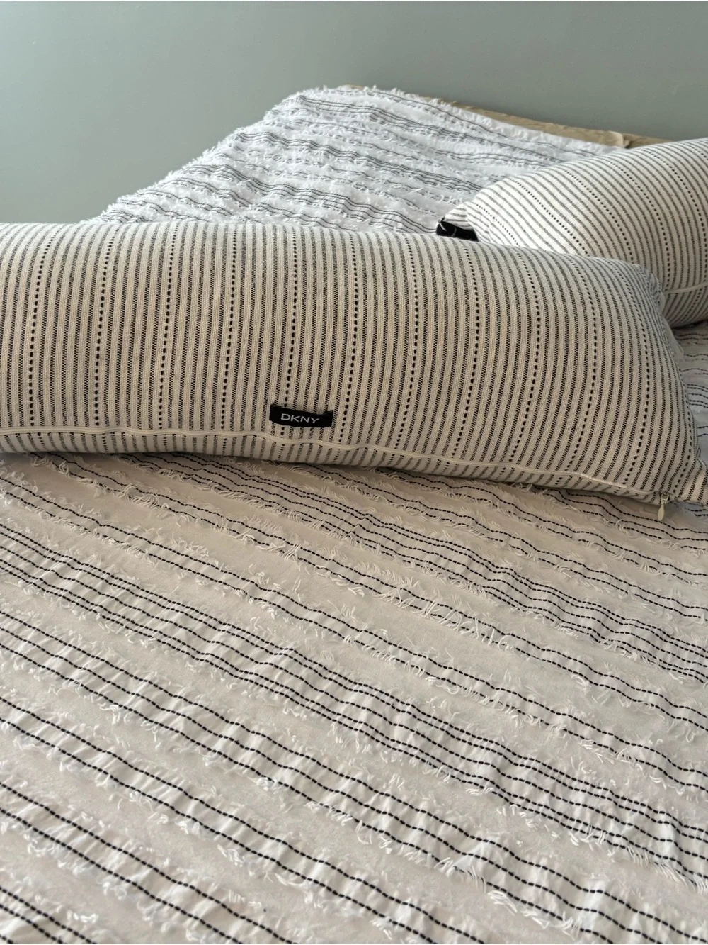 DKNY White Bedspread with Black Striped Bolster Pillows